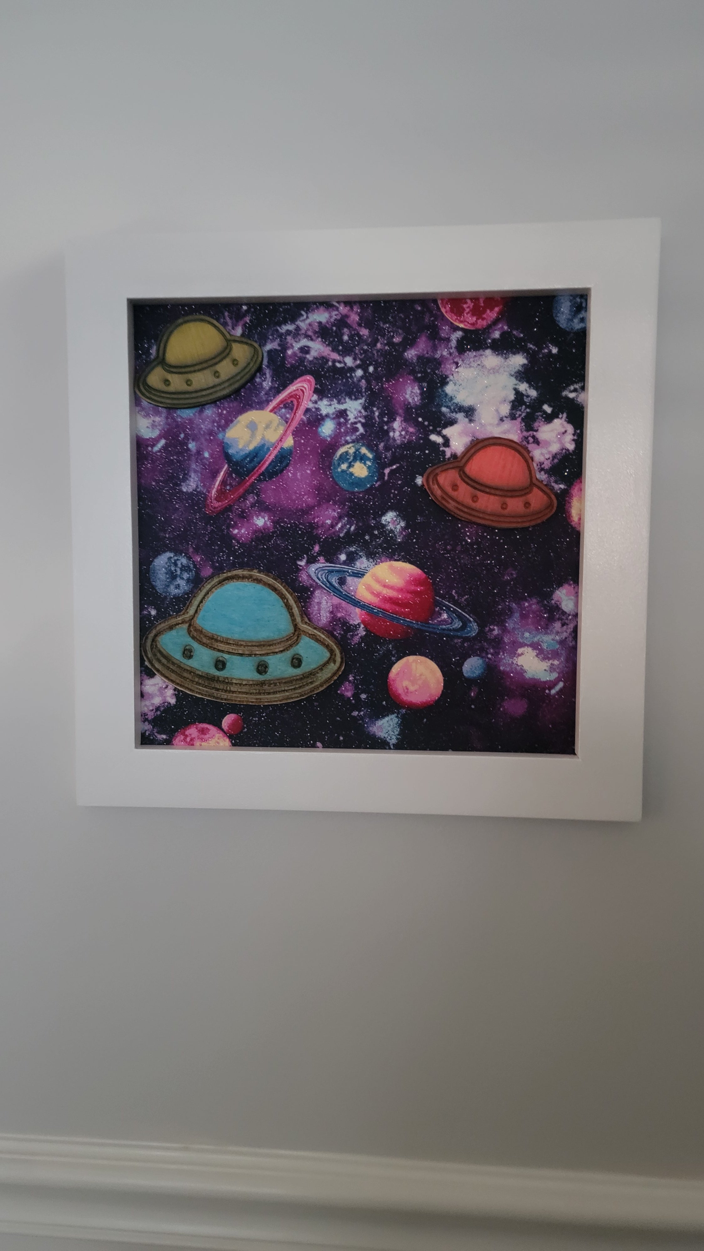 Outer Space Wall Art — Glow in the Dark, Hand Painted, Fabric Background, 12x12, White Frame